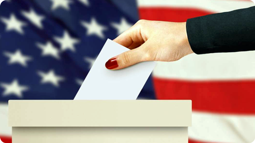 Someone putting a ballot in a box